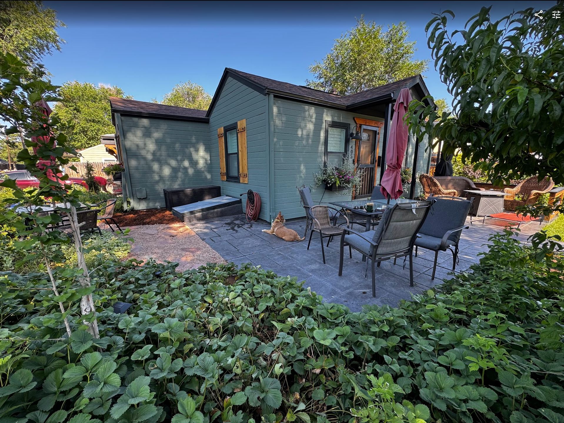 Cottage exterior with patio and garden