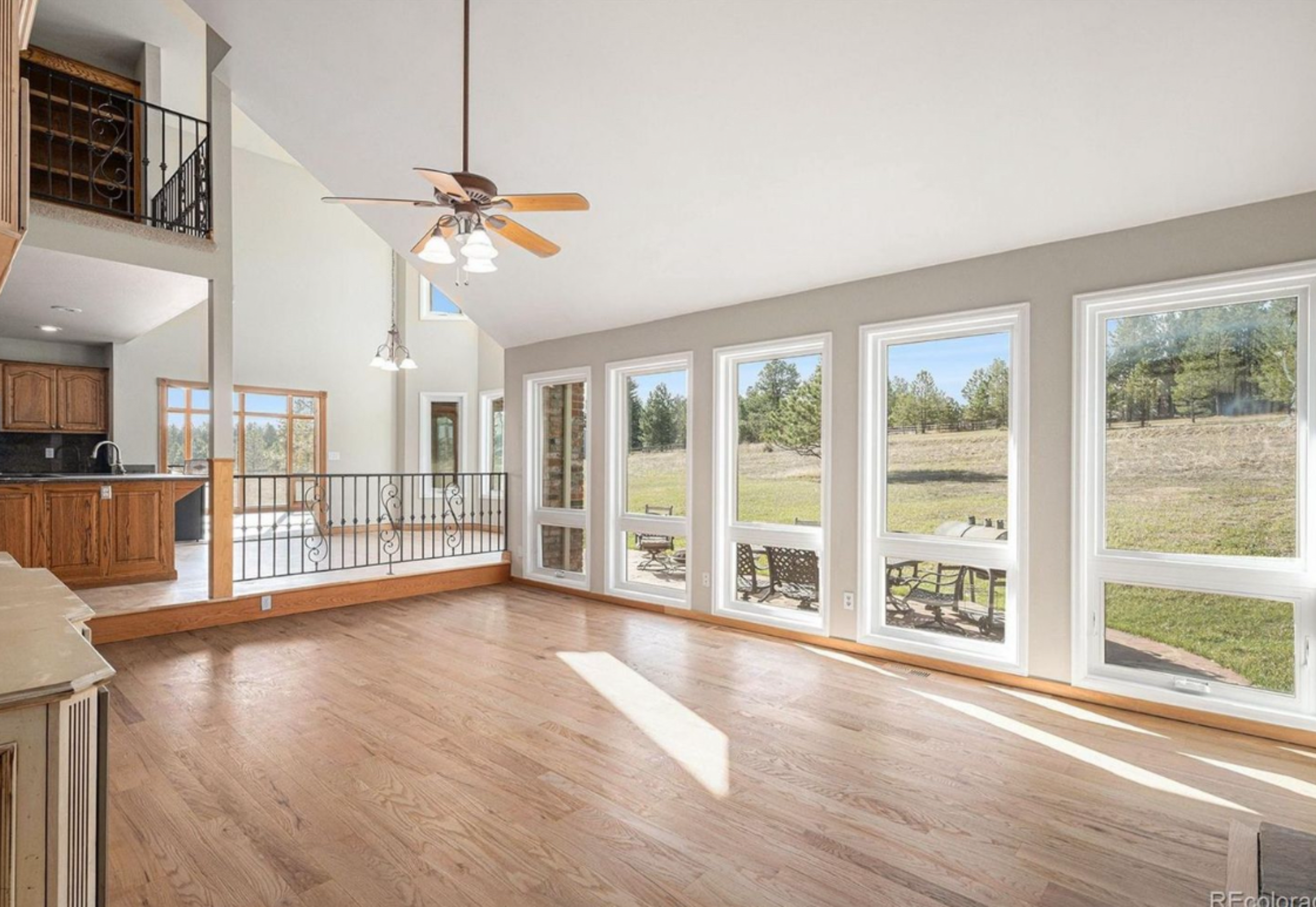 Great room with big windows and hardwood