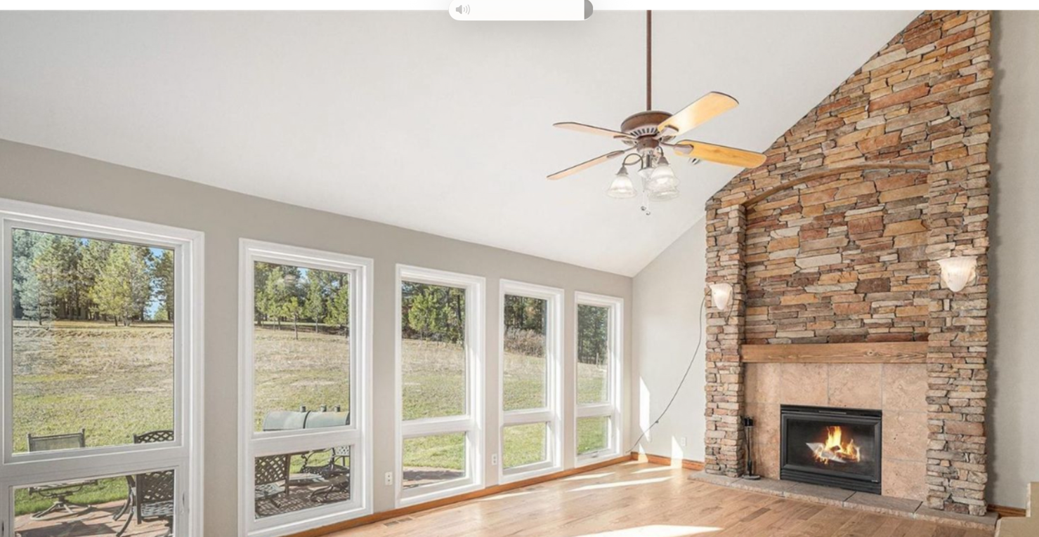 Living room with stone fireplace